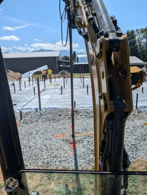 Office Building - Piles standing in layout across the pad as installation continues