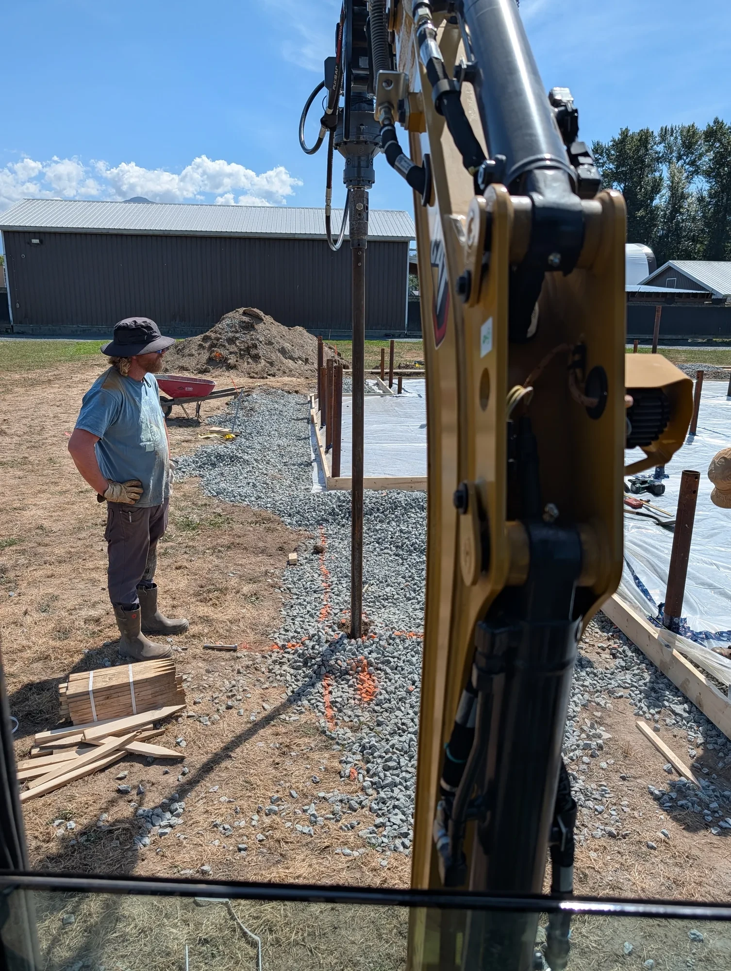 Office Building - A crew member checks position as the next pile goes in