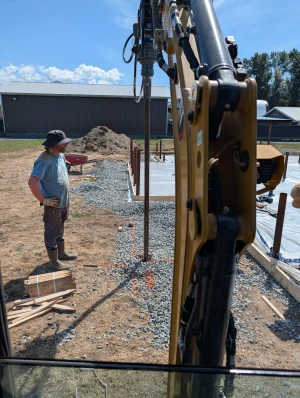 Office Building - A crew member checks position as the next pile goes in