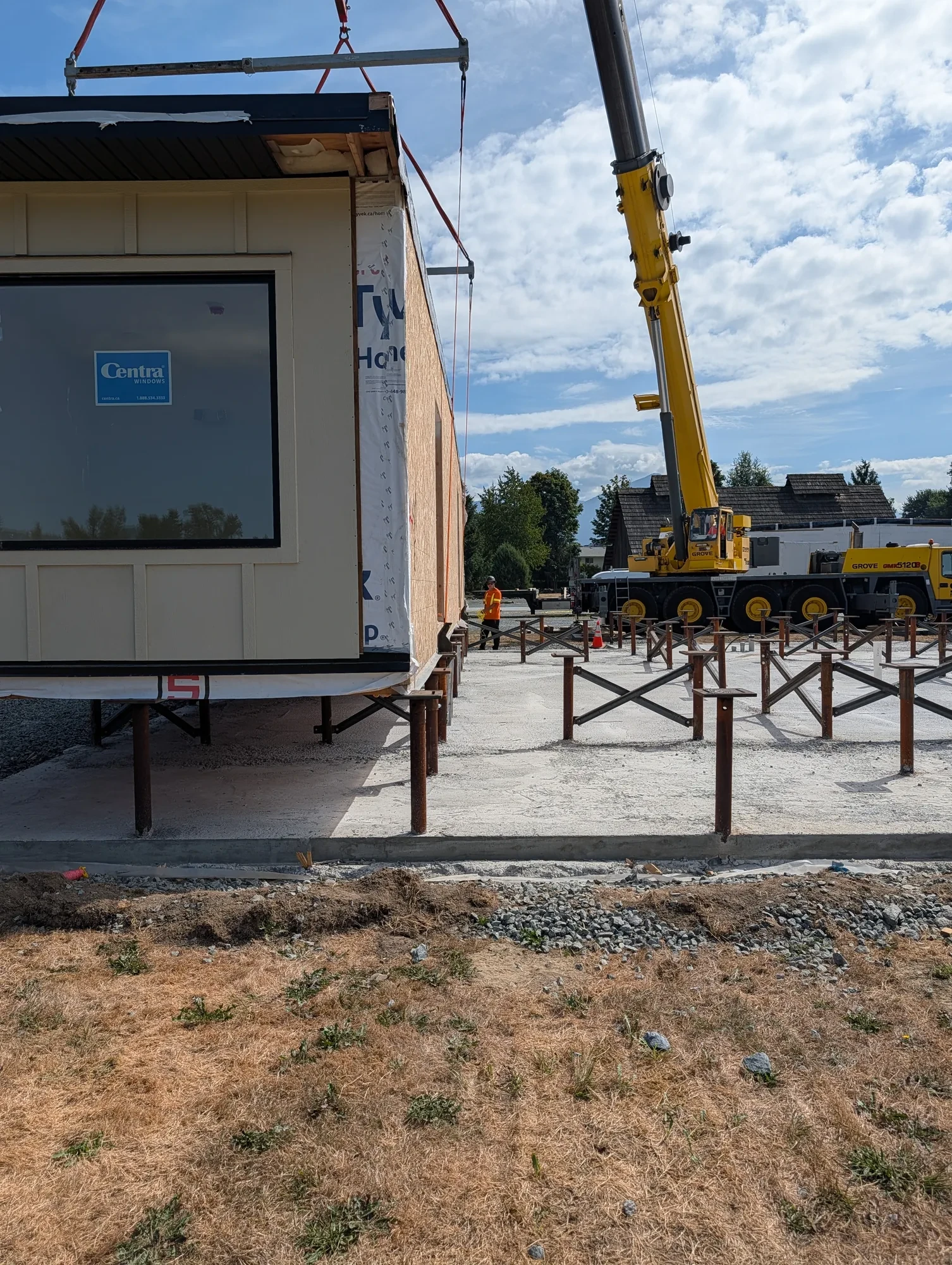 Office Building - First module lifted by crane over the pile frames