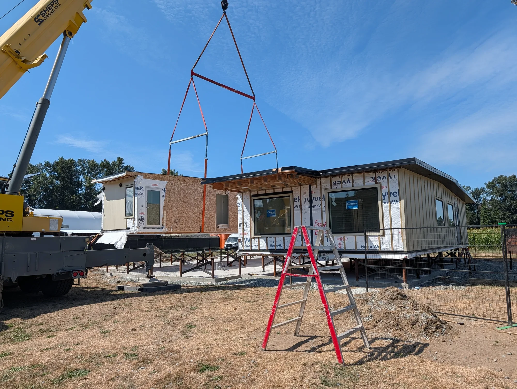 Office Building - Next module swung into place by crane